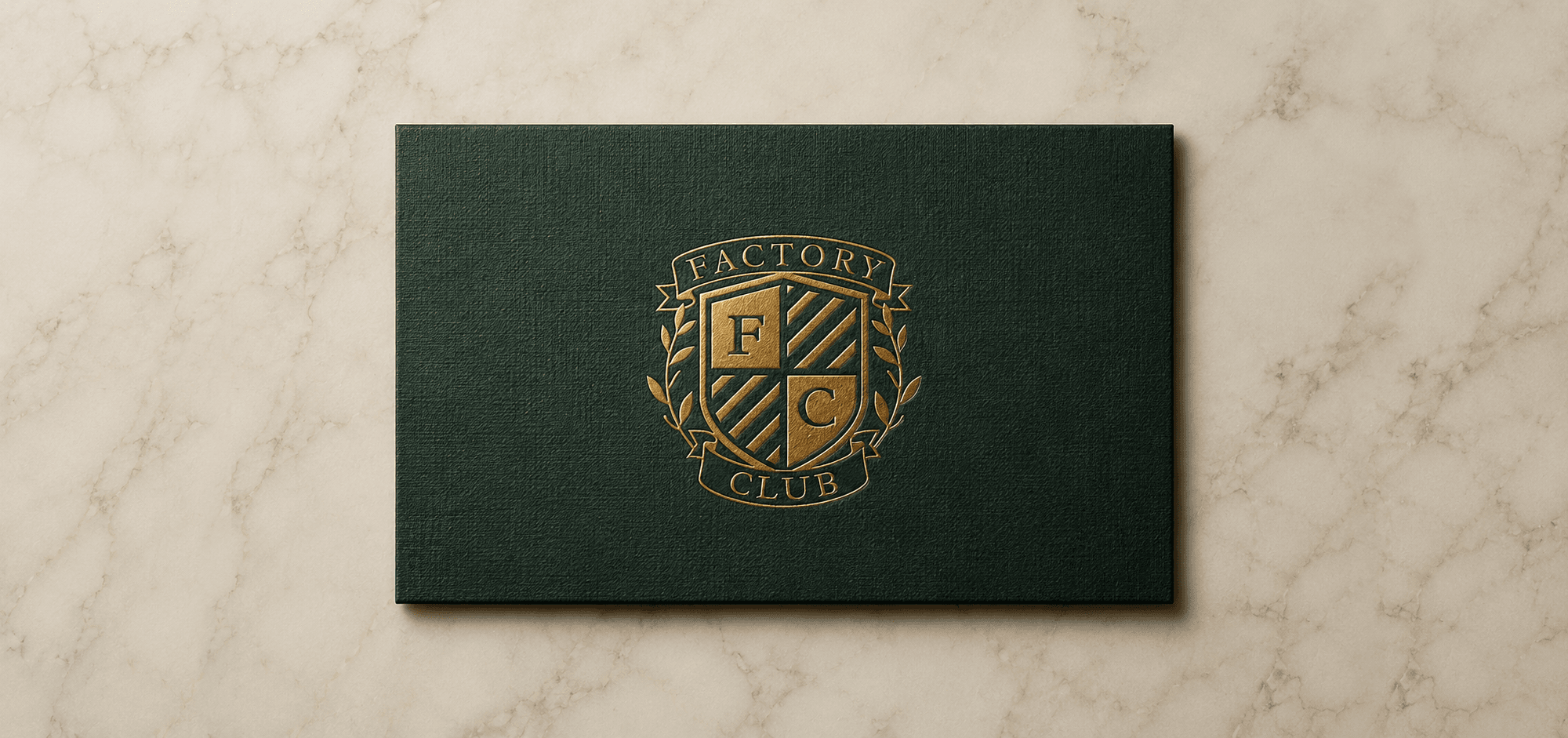 Factory Club green member card on a cream stone surface