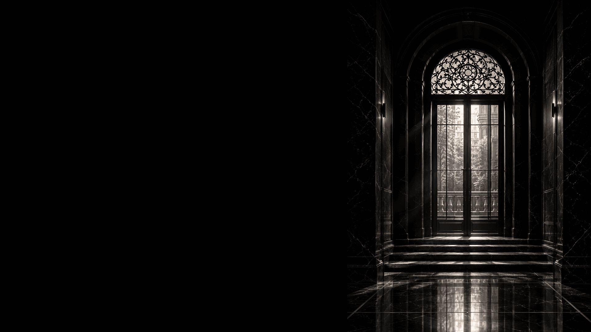 Black marble Factory Club entryway with an arched glass door
