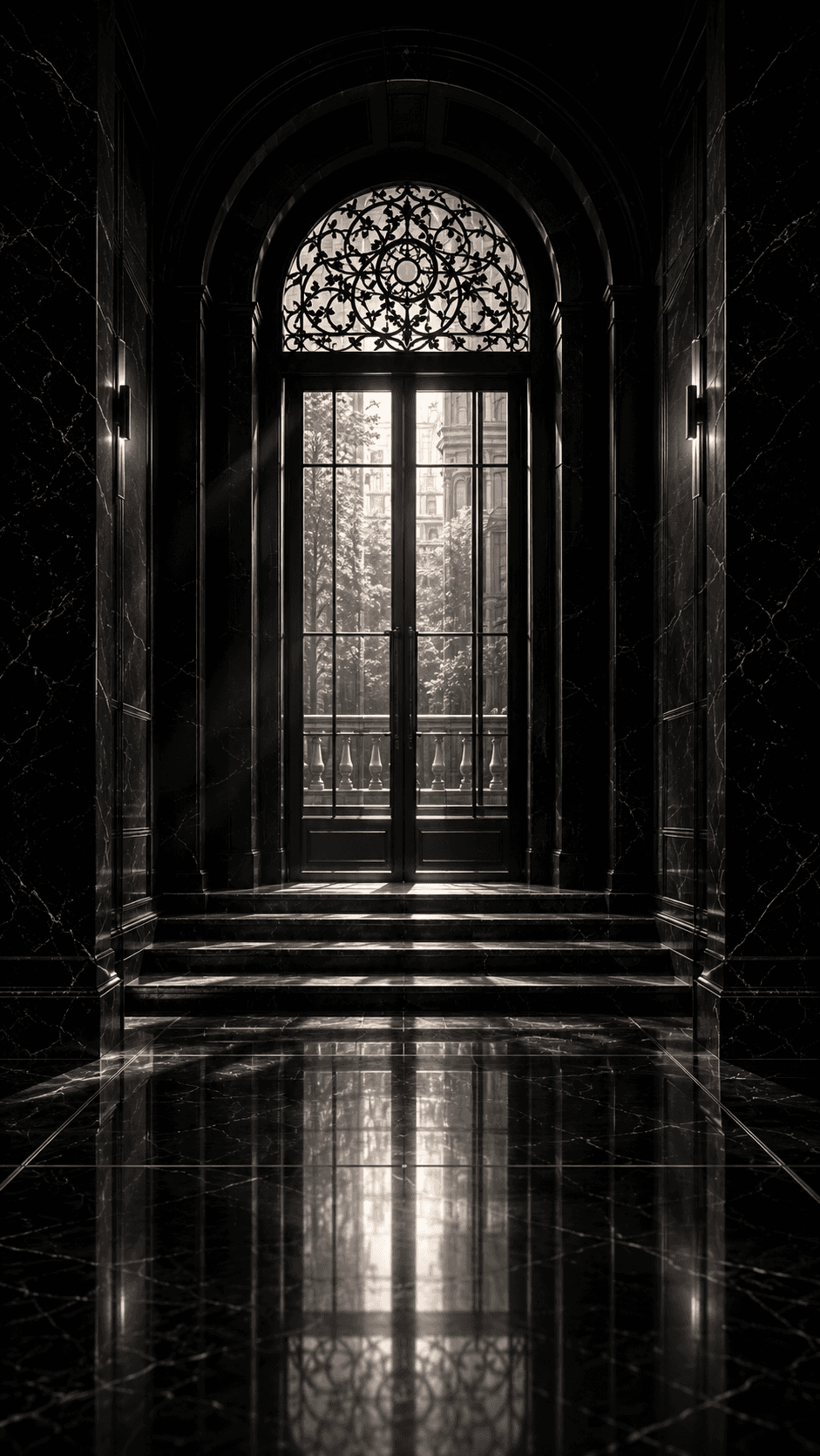 Black marble Factory Club entryway with an arched glass door